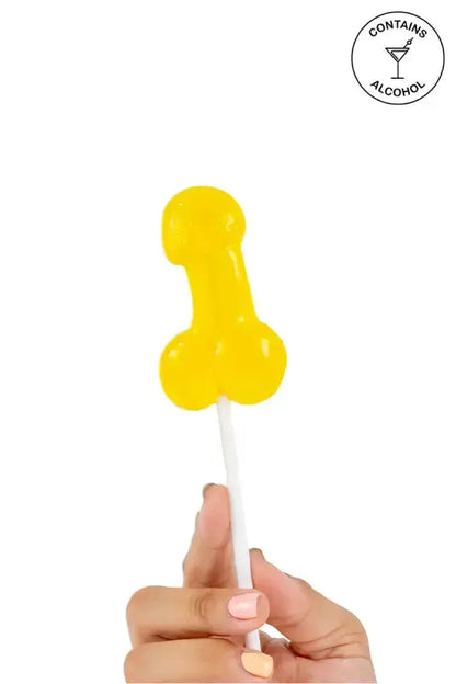 Sucette pénis alcoolisée goût pina colada tenue en main, idéale pour soirées amusantes