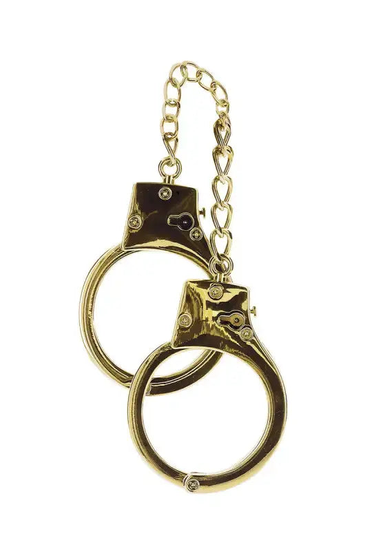 Menottes BDSM plaquées or de Taboom, élégantes et luxueuses, idéales pour des jeux de rôles BDSM.
