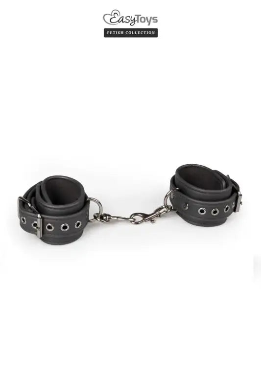 Menottes de bondage Easytoys Fetish Collection en cuir noir pour des jeux BDSM et de séduction.