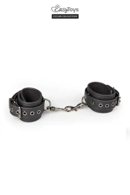 Menottes de bondage Easytoys Fetish Collection en cuir noir pour des jeux BDSM et de séduction.