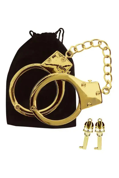 Menottes BDSM plaquées or Taboom présentées avec un petit sac noir, ajoutant une touche d'élégance au BDSM.