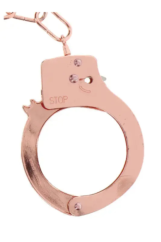 Menottes métal rose gold de TOYJOY, élégantes et glamour pour des jeux de rôles et des fantasmes.