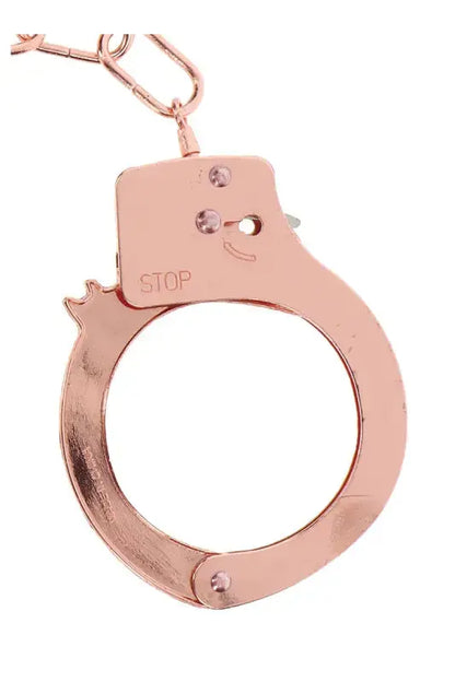 Menottes métal rose gold de TOYJOY, élégantes et glamour pour des jeux de rôles et des fantasmes.