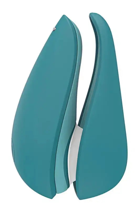 Stimulateur clitoridien Womanizer Liberty 2 bleu pétrole, design élégant et moderne pour une expérience inoubliable.