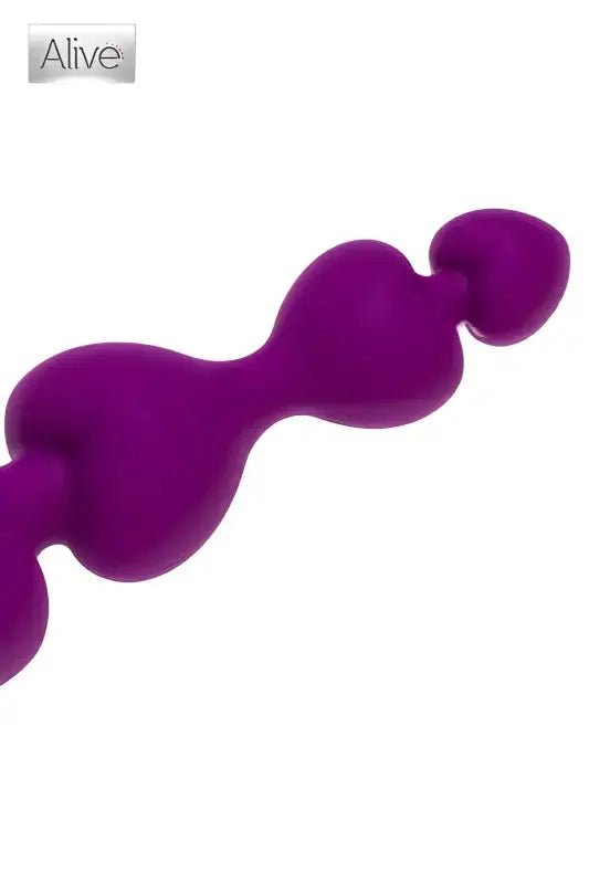 Objet de plaisir en perles violettes.Plug anal  
