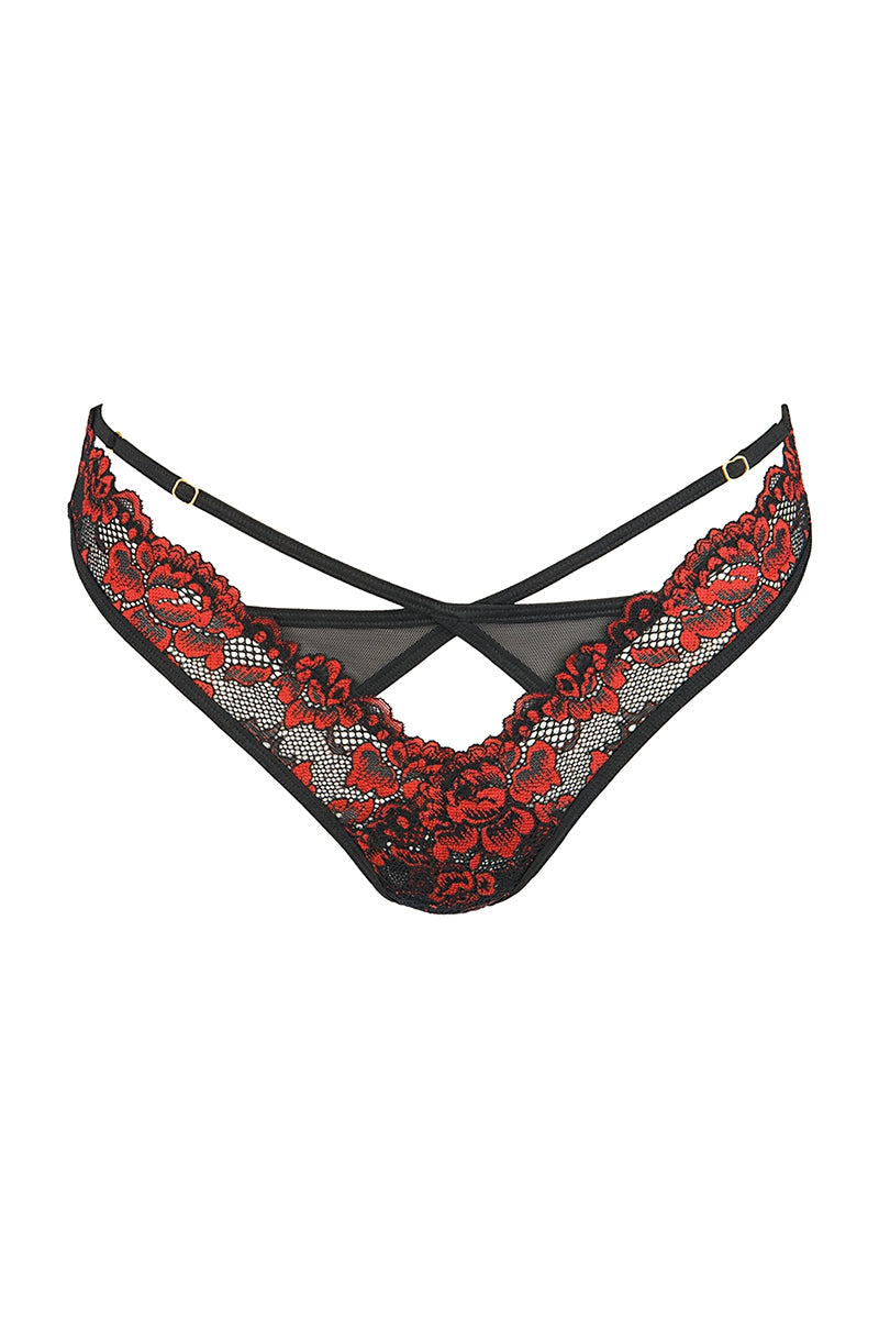 Ce string dentelle original associe une dentelle noire délicate à une broderie rouge raffinée, créant un contraste visuel intense et sophistiqué. Les motifs brodés apportent profondeur et relief, tandis que la coupe ajourée révèle subtilement la silhouette.