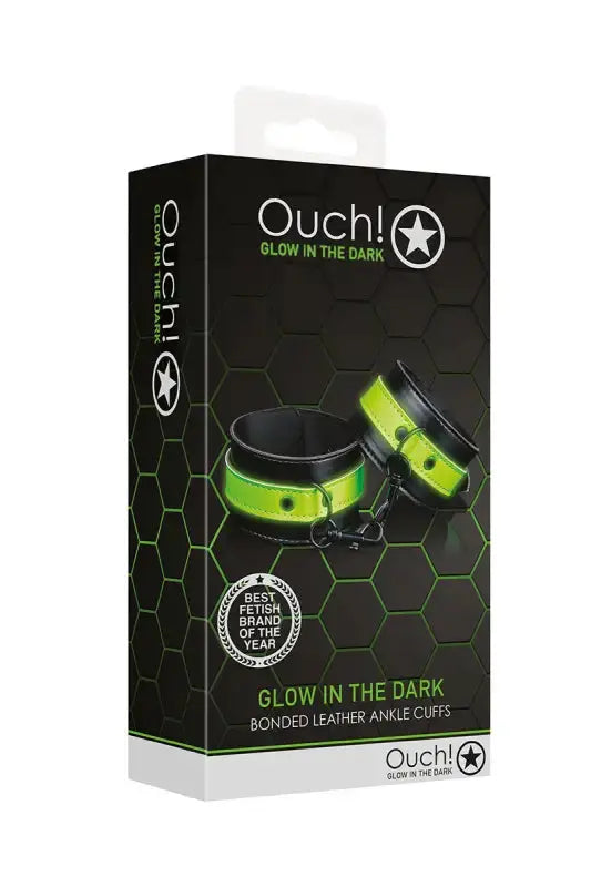 Menottes phosphorescentes Ouch! emballage avec design lumineux et motifs hexagonaux pour des jeux coquins.