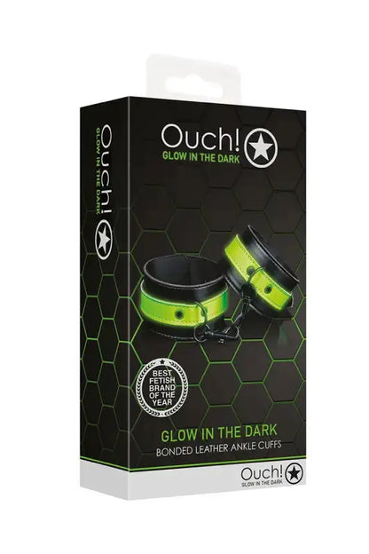 Menottes phosphorescentes Ouch! emballage avec design lumineux et motifs hexagonaux pour des jeux coquins.
