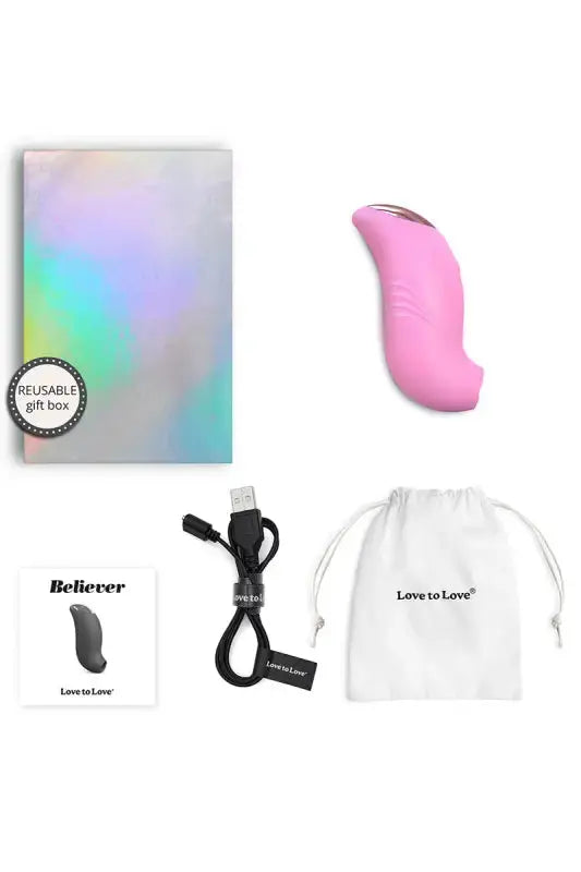 Stimulateur clitoridien Believer rose et ses accessoires