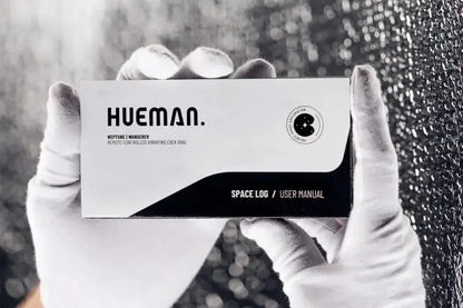 Stimulateur prostatique Hueman Neptune Wand montrant l'emballage et le manuel d'utilisation.