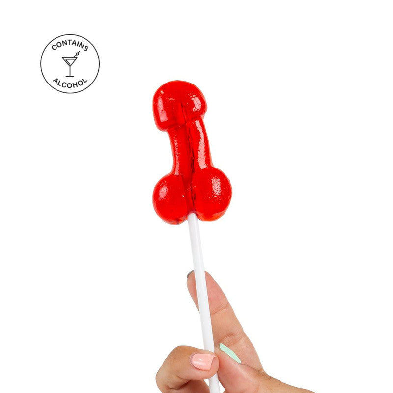 Sucette pénis alcoolisée goût daiquiri fraise tenue par une main, apportant une touche humoristique aux soirées.