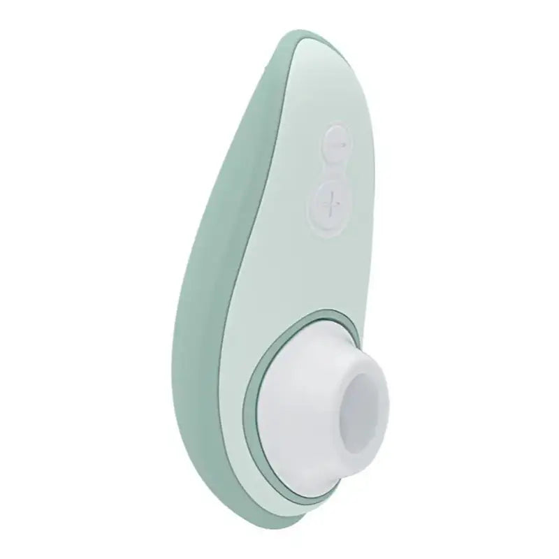 Stimulateur clitoridien Womanizer Liberty 2 en vert, appareil pour orgasmes multiples et moments d’intimité.